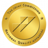 The Joint Commission National Quality Approval gold seal displays a round golden badge to signify healthcare accreditation.