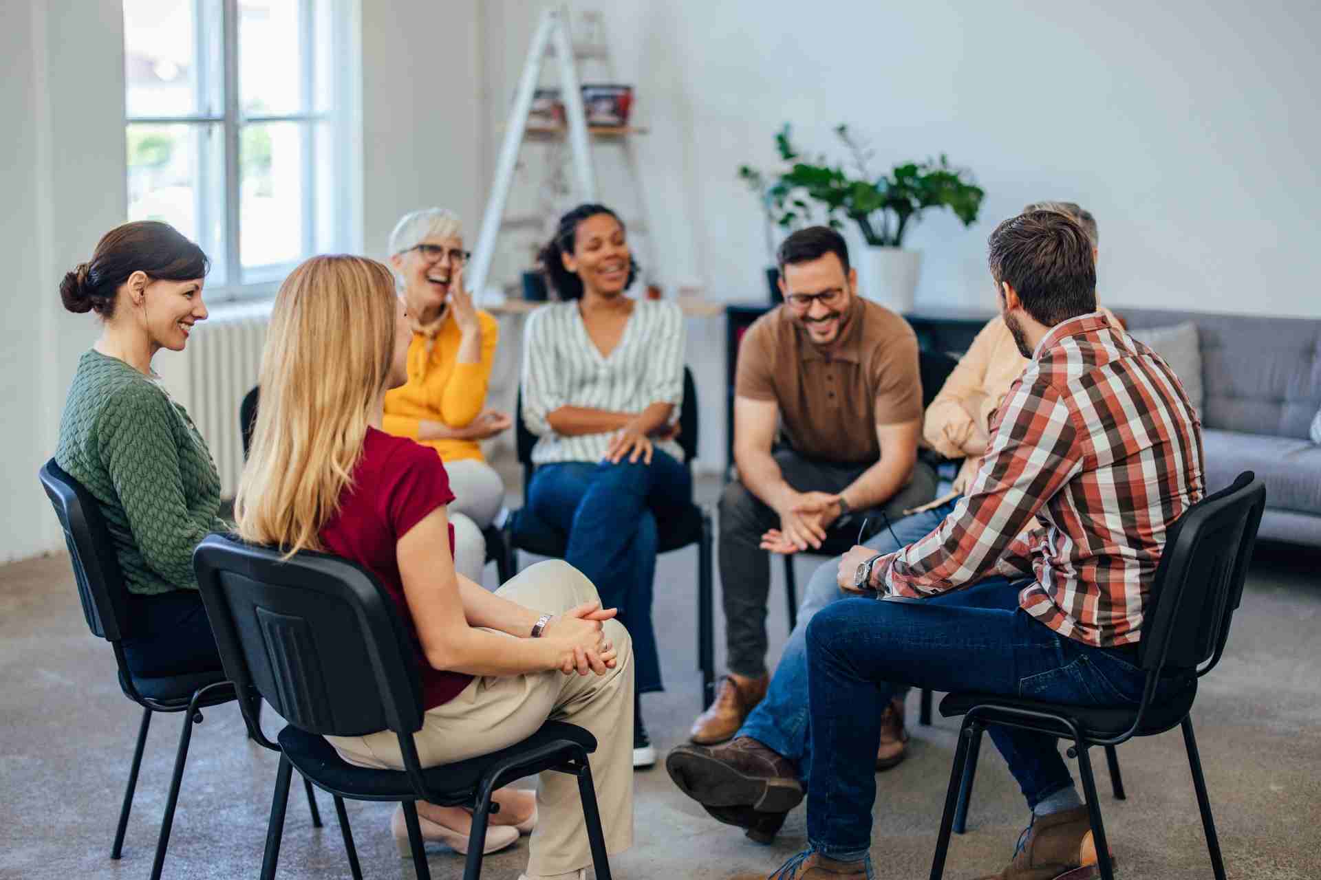 People participating in a group therapy session for mental health support