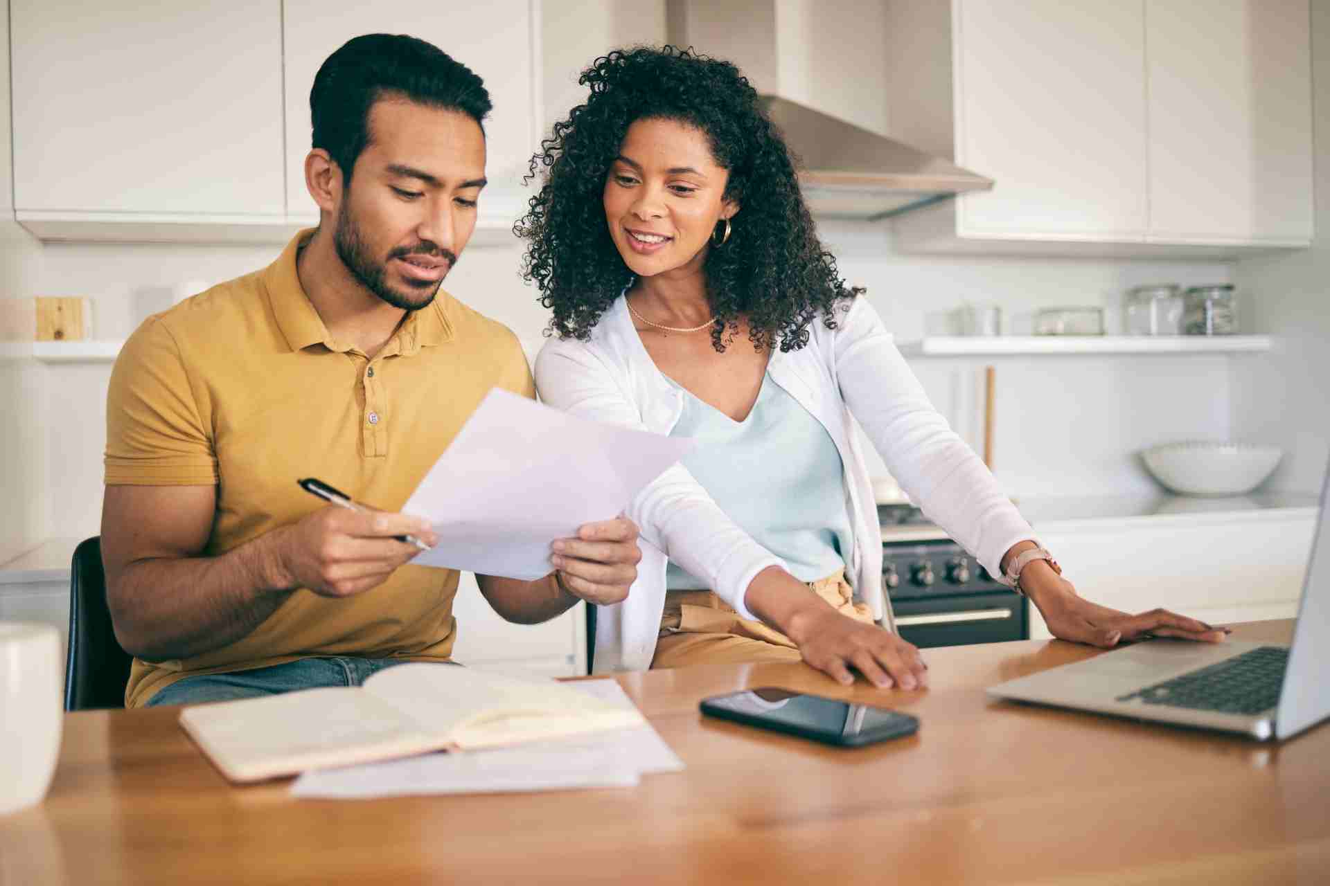 Couple reviewing mental health insurance coverage documents before seeking treatment in Georgia.
